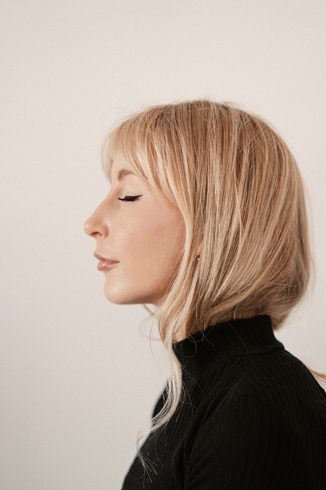 Studio portrait of a woman with short blonde hair